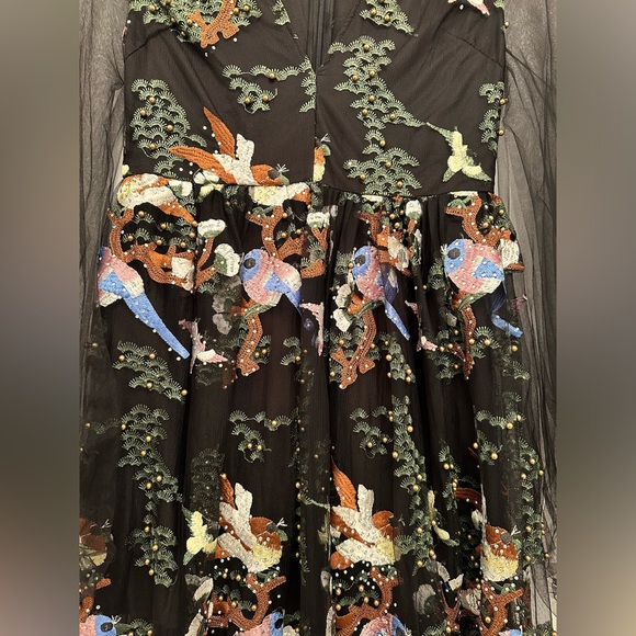 Vibrant beaded dress with a nature scene and she arms - Picture 7 of 11